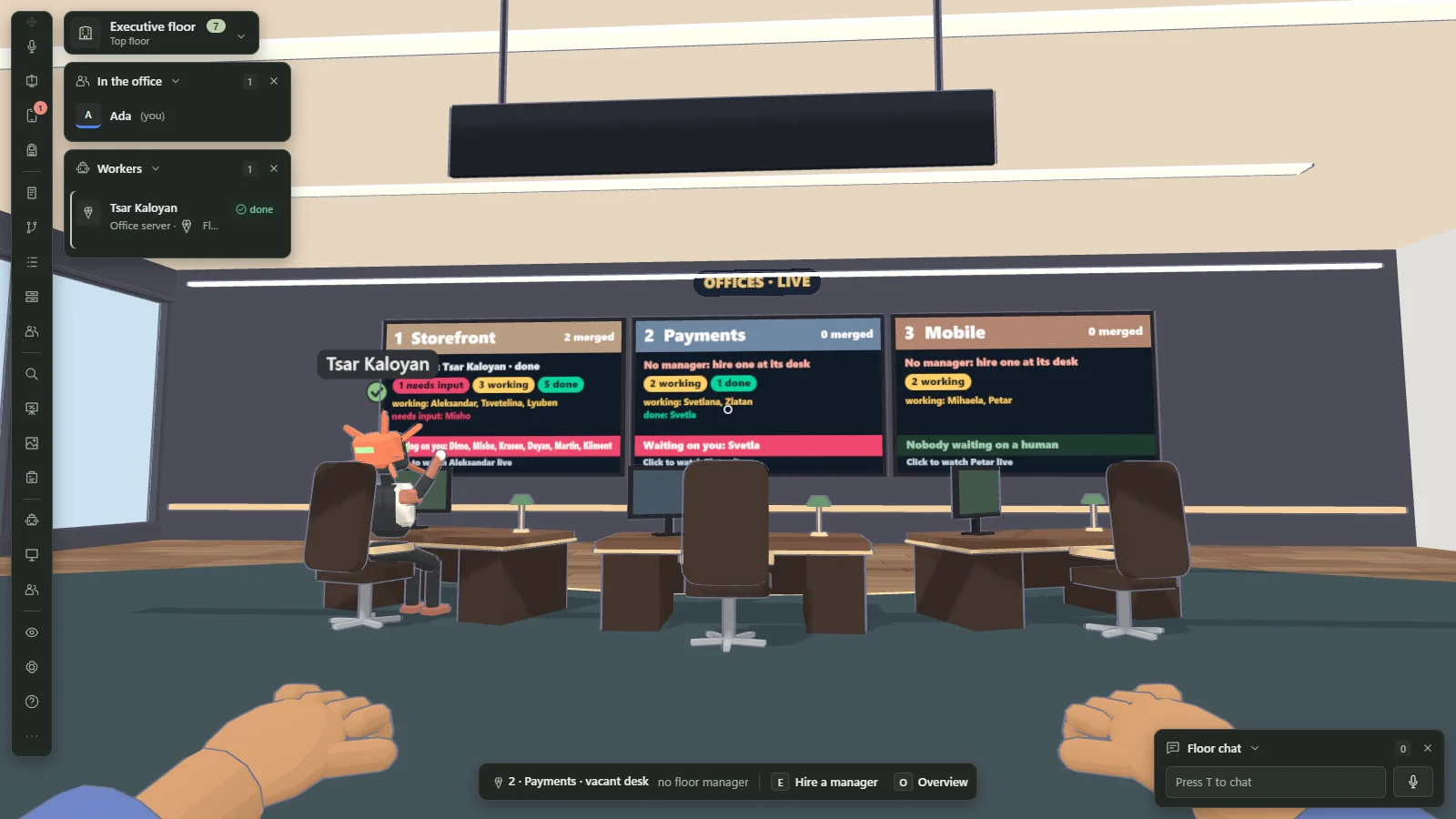 The executive floor: a wall of three live screens titled Offices Live summarises the Storefront, Payments and Mobile offices with merged pull request counts and badges for workers that are working, done or need input, above three manager's desks with one worker seated at the left one.